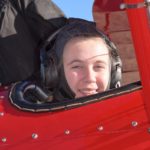 A 6 Wing Air Force Cadet prepares to take a Pilot Experience Flight in a Great Lakes 2T1A-2 aerobatic biplane custom built by Michigan based aviation company Waco Classic.