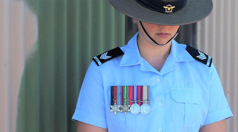 Cadet Sergeant Casey Dibben (No 6 Wing AAFC) wears the medals of her maternal great-grandfather Private Geoffrey Whiteman (6th Australian Division Workshops AIF).