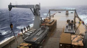 HMAS Choules battles heavy seas in transit to north Queensland. Photo by Able Seaman Bonnie Gassner.