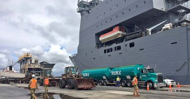 ADF vehicles and equipment from the Army's Engineer Support Regiment, based at Gallipolli Barracks are loaded on board HMAS Choules in Brisbane before heading north to support cyclone-affected communities in north Queensland.