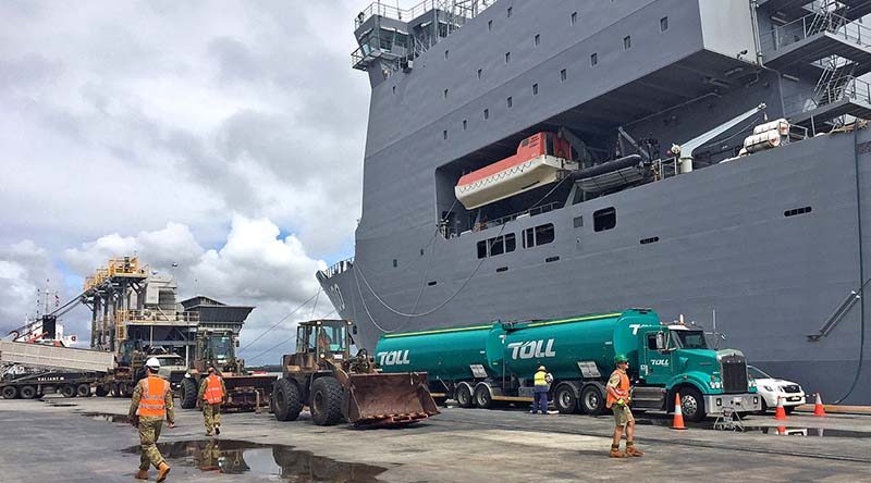 ADF vehicles and equipment from the Army's Engineer Support Regiment, based at Gallipolli Barracks are loaded on board HMAS Choules in Brisbane before heading north to support cyclone-affected communities in north Queensland.