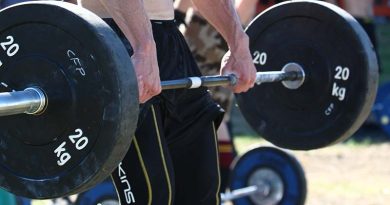 Deadlifting for max reps at a Crossfit comp. Photo by Brian Hartigan.