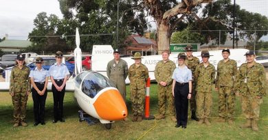 The AAFC ASK-21 Mi glider with cadets from No 602 Squadron at Woodside, SA (left to right): CDT Grace Wilton, LCDT Anita Gardner, CCPL Benjamin Grillett, LCDT Ben Carter, CCPL Erika Gardner, CCPL Blake Harding, CDT Bianca Willsmore, LCDT Aiden Carling, CDT Lachlan Willsmore, CDT Kyle Bratkovic and CCPL Olivia Gardner. Leading Cadet Ben Carter (in Flying Dress) qualified for his Solo Gliding Badge in 2014.