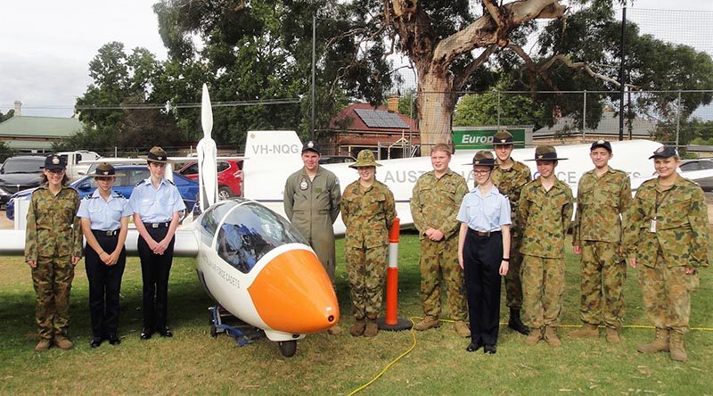 The AAFC ASK-21 Mi glider with cadets from No 602 Squadron at Woodside, SA (left to right): CDT Grace Wilton, LCDT Anita Gardner, CCPL Benjamin Grillett, LCDT Ben Carter, CCPL Erika Gardner, CCPL Blake Harding, CDT Bianca Willsmore, LCDT Aiden Carling, CDT Lachlan Willsmore, CDT Kyle Bratkovic and CCPL Olivia Gardner. Leading Cadet Ben Carter (in Flying Dress) qualified for his Solo Gliding Badge in 2014.
