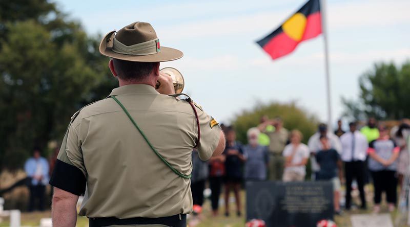 Australian Army Band Adelaide Bugler, Corporal Andrew Barnett, plays the Last Post for World War One soldier, Private Miller Mack, during his reinterment service in Raukkan, South Australia on 24 March 2017. Photo by Sergeant W Guthrie.