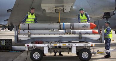 Avionics Technicians from 11 Squadron load an AGM-84 Harpoon Missile onto an AP-3C Orion aircraft at the Marine Corps Base Hawaii during Exercise Rim of the Pacific (RIMPAC) 2016. Photo by Able Seaman Kayla Hayes.