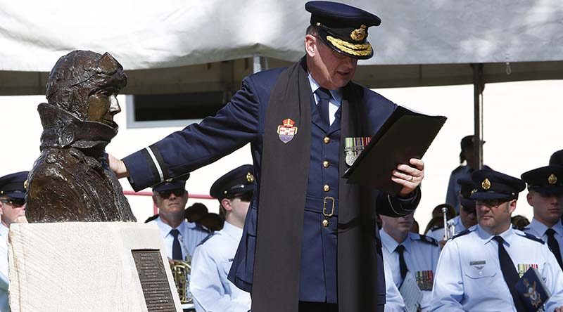 Air Force Director-General Chaplaincy, Air Commodore Kevin Russell, blesses Air Marshal Sir George Jones' memorial during the Rushworth RSL’s Centenary of Anzac Commemoration Ceremony. Photo by Corporal Colin Dadd.