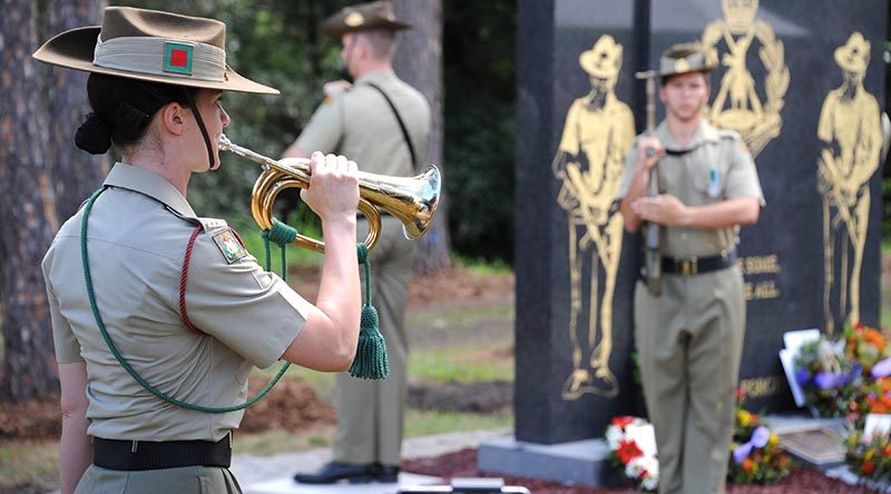 Musician Acacia Cuthbertson, from the Australian Army Band Brisbane, plays the last post at the blessing and dedication of The Royal Australian Regiment Memorial at Ferguson Park, Enoggera on 24 March 2017. Photo by Captain Anna-Lise Rosendahl.