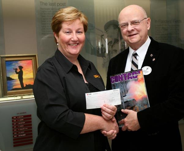 Rosie Hartigan, Business Manager for CONTACT magazine, presents a cheque for $5,000 to Legacy Australia Council Chairman Charles Wright. The cheque represents a pledge (and a little extra) from the sale of a one-off special issue of CONTACT magazine to mark the 60th anniversary of Infantry. CONTACT told its readers that $1 from every sale of the special issue would be donated to Legacy. CONTACT magazine is a first-person Defence-focused magazine sold four times per year through newsagents Australia wide.