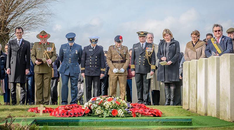 Dignitaries at the burial ceremony of the partial remains of an unknown First World War New Zealand soldier and the partial remains of two British soldiers today at the Perth (China Wall) Commonwealth War Graves Cemetery near Ieper, in Belgium.