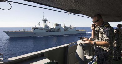 Lieutenant Aaron Norley conning HMAS Ballarat in company with the Royal Canadian Navy ship HMCS Winnipeg conduct Officer of the Watch manoeuvres during HMAS Ballarat's South East Asia Deployment. Photo by Able Seaman Bradley Darvill.