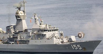 Royal Australian Navy's HMAS Ballarat fires her gun during an exercise with a Chinese ship, near Zhanjiang, China. Photo by Leading Seaman Bradley Darvill.