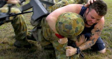 An Australian soldier strugles with a 'protester' on an exercise in Tin Can Bay. Photo by Corporal Chris Moore.