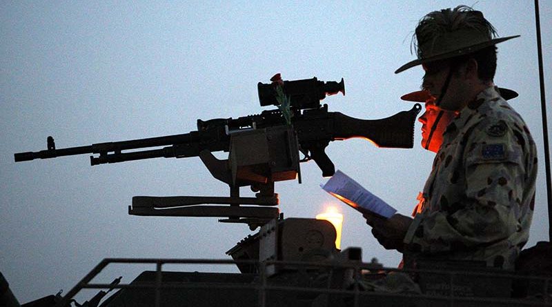 Members of the 2nd/14th Light Horse Regiment (Queensland Mounted Infantry) participate in the ANZAC Day Dawn Service at Talil, Iraq, 2008. Photo by Brian Hartigan.