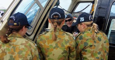 Major Genevieve 'Gen' Rueger shows 6 Wing AAFC Cadets the Defence Force Recruiting Bell Jet Ranger III at the Barossa Air Show. Photo by Pilot Officer (AAFC) Paul Rosenzweig.