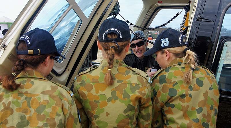 Major Genevieve 'Gen' Rueger shows 6 Wing AAFC Cadets the Defence Force Recruiting Bell Jet Ranger III at the Barossa Air Show. Photo by Pilot Officer (AAFC) Paul Rosenzweig.