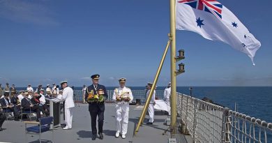 Chief of Defence Force Air Chief Marshal Mark Binskin and Chief of Navy Vice Admiral Tim Barrett carry wreaths to cast from the flight deck of HMAS Choules during the commemoration of the Battle of the Coral Sea. Photo by Able Seaman Richard Cordell.