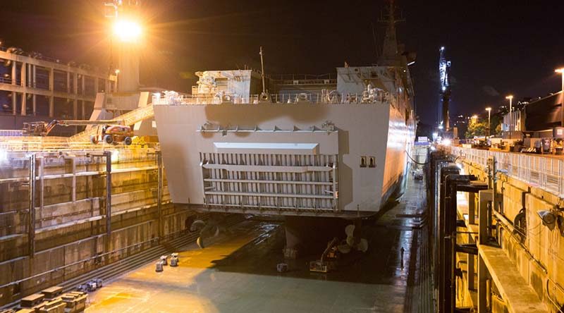 HMAS Adelaide rests on blocks within Captain Cook Graving Dock at Fleet Base East, Sydney, after entering dry dock for maintenance. Photo by Leading Seaman Peter Thompson.