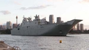 HMAS Canberra rounds the point of Garden Island as the ship sails out of Sydney Harbour to test her propulsion systems. Photo by Petty Officer Kelvin Hockey.