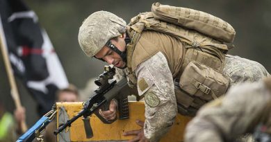 A New Zealand Army soldier clears the wall in an obstacle course match during the Australian Army Skill at Arms Meeting at Puckapunyal, Victoria. Photo by Sergeant Janine Fabre