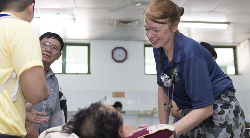 Royal Australian Navy Nursing Officer Lieutenant Commander Alison Zilko tends to a Vietnamese patient at the Emergency Reception at Da Nang General Hospital during Exercise Pacific Partnership 2017. Photo by Sergeant Ray Vance.