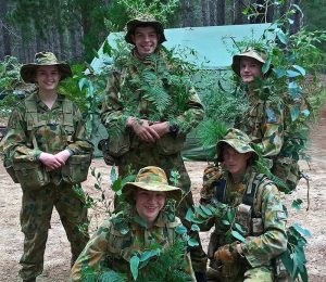 Cadets from 617 and 619 Squadrons practice camouflage and concealment – (back): LCDT Catriona Mathison, CCPL Nathan Richmond and LCDT Justin Blake; (front): LCDT Stephen Davis and CCPL Alexander Barrott-Walsh. 