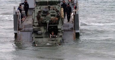 A LAV comes ashore from a landing craft during Exercise Joint Waka. Photo courtesy AirflowNZ.