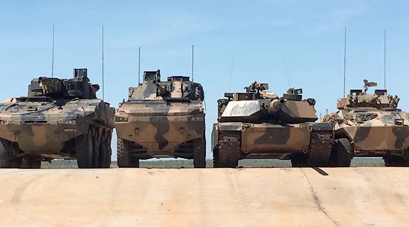 Left to right – Rheinmetall Boxer CRV, BAE Systems Australia/Patria AMV-35, an Australian Army Abrams main battle tank and an ASLAV at Mount Bundey, Northern Territory. Photographer unknown.