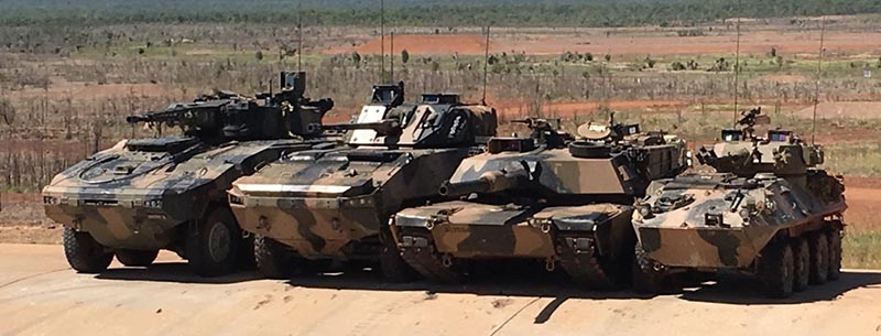 From left to right above – Rheinmetall Boxer CRV, BAE Systems Australia/Patria AMV-35, an Australian Army Abrams main battle tank and an ASLAV at Mount Bundey, Northern Territory. Photographer unknown.