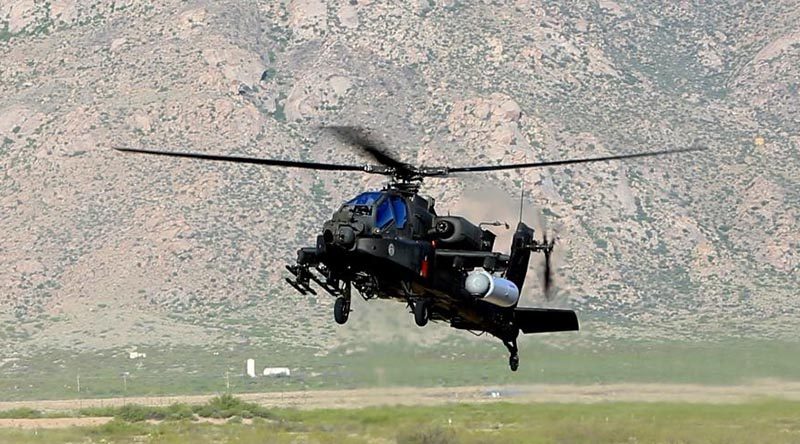 US Army AH-64 Apache fitted with Raytheon high-energy laser test capsule. US Army photo.