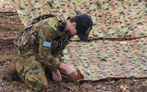 A Cadet from No 613 Squadron (Edinburgh) prepares an individual shelter as part of the Wing Fieldcraft Competition. Image by Pilot Officer (AAFC) Paul Rosenzweig