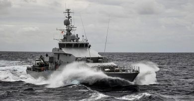 HMNZS Hawea takes up station alongside HMAS Wollongong as the two ships practice Officer of the Watch manoeuvres off Fiji. Photo by Able Seaman Neil James.