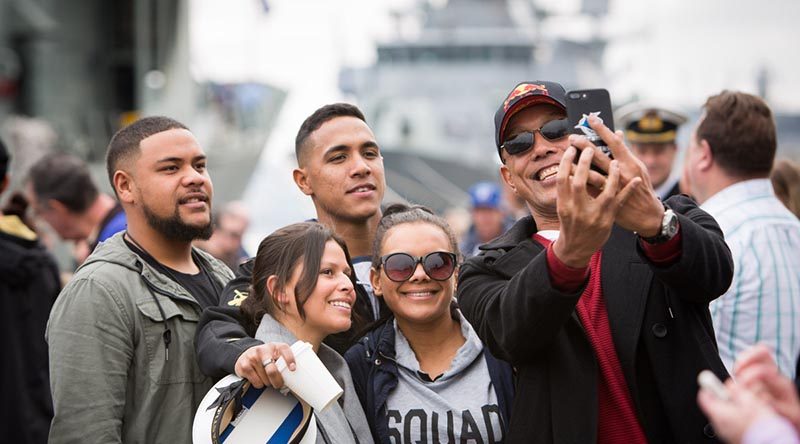 Family members pose for a selfie on the wharf at Fleet Base East before HMAS Newcastle departs for Operation Manitou. Photo by Able Seaman Bonny Gassner.