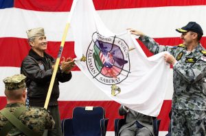 Commander US Pacific Command Admiral Harry Harris Jr and Australian Chief of Joint Operations Vice Admiral David Johnston unfurl the Talisman Sabre 2017 flag aboard USS Bonhomme Richard. Photo by Petty Officer Andrew Dakin.