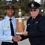 Cadet Sergeant Michael Santos receives the Wing Aircraft Recognition Competition trophy from OC 6 Wing, Wing Commander (AAFC) Peter Gill.