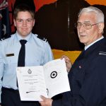 LCDT Lachlan Jenkins receives his Gold Rifle badge from the CO 604 Squadron, FLGOFF (AAFC) John Bennett.