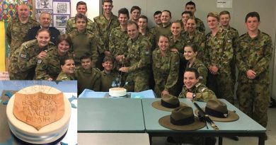 Outgoing Commanding Officer of No 619 Squadron FLGOFF(AAFC) Simon Blair cuts his farewell cake with members of the squadron. Image supplied by 610 SQN