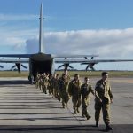 6 Wing Australian Air Force Cadets disembark a 37 Squadron C-130J Hercules after an air-experience flight.