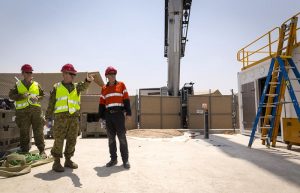 Richard Blundell from Datapod (right) speaks with Head of Information and Communications Technology Operations Air Vice Marshall Andrew Dowse (pointing) about the Containerised Data Centre.