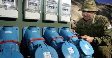 Leading Aircraftman Cameron Lambert, an Electrician from 1 Airfield Operational Support Squadron RAAF Richmond, helps to keep the electricity flowing at RAAF Base Tindal during exercise Talisman Saber 2009. Photo by Corporal Melinda Mancuso.