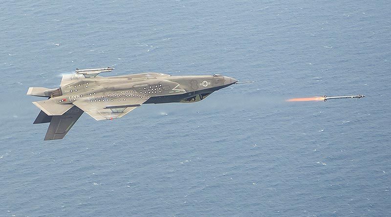 An inverted F-35C, piloted by Major Eric Northam, launches an AIM-9X missile during a live-fire test at Naval Air Station Patuxent River, Maryland, on 8 June. Lockheed Martin photo by Dane Wiedmann.