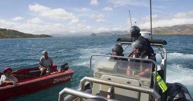 Fijian Fisheries Officer Waisea Aka speaks to a local fisherman during a HMNZS Hawea-assisted fisheries and customs patrol in Fiji. NZDF photo.
