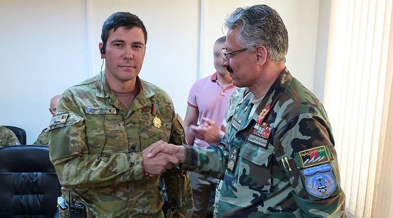 Australian Army Major Conrad Walsh is awarded the Afghan Ministry of Interior Medal of Honour.