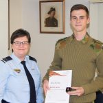 Leading Cadet Michael Strumpher of 604 Squadron receives his Bronze Level badge and certificate from FLTLT(AAFC) Rae Nicholas, the 6 Wing Duke of Edinburgh International Award Coordinator. Image by Pilot Officer (AAFC) Paul Rosenzweig