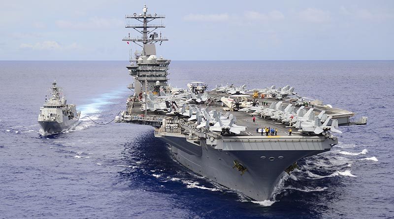 HMNZS Te Kaha gets a top-up of aviation fuel from USS Nimitz during combined operations in the western Pacific. US Navy photo by Mass Communication Specialist 3rd Class Ian Kinkead.