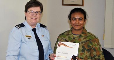 Leading Cadet Tharane Thamodarar of 604 Squadron receives a Bronze Level Badge and certificate from FLTLT(AAFC) Rae Nicholas, the 6 Wing Duke of Edinburgh International Award Coordinator. Image by Pilot Officer (AAFC) Paul Rosenzweig