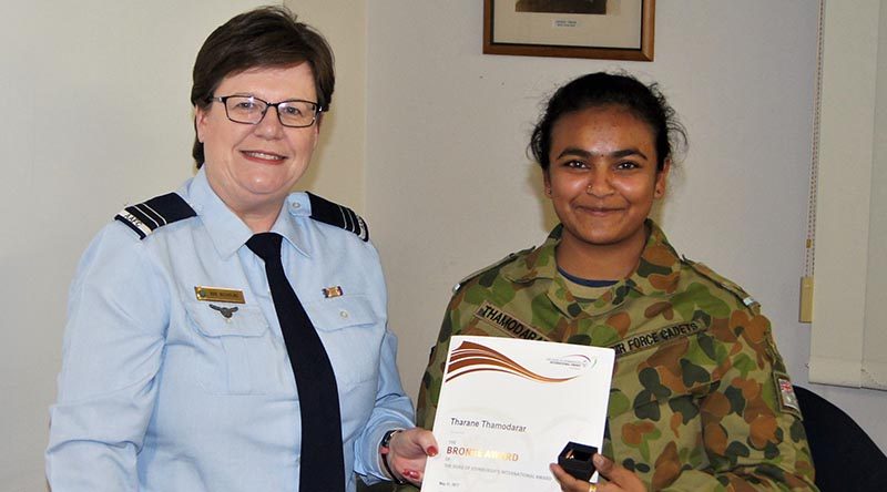 Leading Cadet Tharane Thamodarar of 604 Squadron receives a Bronze Level Badge and certificate from FLTLT(AAFC) Rae Nicholas, the 6 Wing Duke of Edinburgh International Award Coordinator. Image by Pilot Officer (AAFC) Paul Rosenzweig