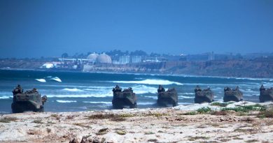 Marines with 3rd Assault Amphibian Battalion, and 4th AABn., perform an amphibious raid at Camp Pendleton, California. USMC photo by Corporal Joshua Young.