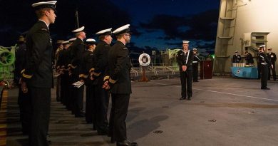 Crewmembers of HMAS Canberra III hold a memorial service to commemorate the 75 Anniversary of the loss of HMAS Canberra I during the Battle of Savo Island.
