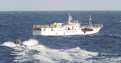 A Zodiac from HMNZS Otago, with fisheries officers from New Zealand and Vanuatu, approaches a fishing vessel in the south-west Pacific during Operation Island Chief. NZDF photo.